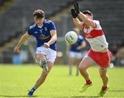 29 May 2021; Luke Fortune of Cavan scores a point despite the attention of Conor Doherty of Derry during the Allianz Football League Division 3 North Round 3 match between Cavan and Derry at Kingspan Breffni in Cavan. Photo by Harry Murphy/Sportsfile