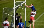 29 May 2021; Martin Reilly of Cavan scores his side's second goal despite the attention of Michael McEvoy of Derry during the Allianz Football League Division 3 North Round 3 match between Cavan and Derry at Kingspan Breffni in Cavan. Photo by Harry Murphy/Sportsfile