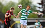 29 May 2021; Aaron O'Driscoll of Longford Town in action against Rory Gaffney of Shamrock Rovers during the SSE Airtricity League Premier Division match between Longford Town and Shamrock Rovers at Bishopsgate in Longford. Photo by Seb Daly/Sportsfile