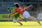 29 May 2021; Eoghan McGettigan of Donegal is tackled by James Morgan of Armagh during the Allianz Football League Division 1 North Round 3 match between Armagh and Donegal at the Athletic Grounds in Armagh. Photo by Piaras Ó Mídheach/Sportsfile