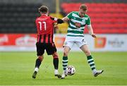 29 May 2021; Sean Hoare of Shamrock Rovers in action against Callum Thompson of Longford Town during the SSE Airtricity League Premier Division match between Longford Town and Shamrock Rovers at Bishopsgate in Longford. Photo by Seb Daly/Sportsfile