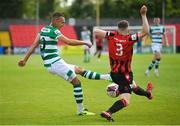 29 May 2021; Graham Burke of Shamrock Rovers in action against Paddy Kirk of Longford Town during the SSE Airtricity League Premier Division match between Longford Town and Shamrock Rovers at Bishopsgate in Longford. Photo by Seb Daly/Sportsfile