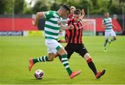 29 May 2021; Aaron Greene of Shamrock Rovers in action against Paddy Kirk of Longford Town during the SSE Airtricity League Premier Division match between Longford Town and Shamrock Rovers at Bishopsgate in Longford. Photo by Seb Daly/Sportsfile