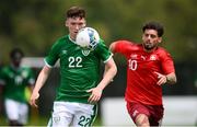30 May 2021; Conor Grant of Republic of Ireland in action against Kastriot Imeri of Switzerland during the U21 international friendly match between Switzerland and Republic of Ireland at Dama de Noche Football Centre in Marbella, Spain. Photo by Stephen McCarthy/Sportsfile
