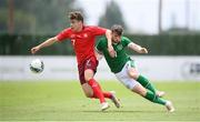 30 May 2021; Tim Staubli of Switzerland in action against Will Ferry of Republic of Ireland during the U21 international friendly match between Switzerland and Republic of Ireland at Dama de Noche Football Centre in Marbella, Spain. Photo by Stephen McCarthy/Sportsfile