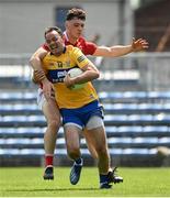 30 May 2021; David Tubridy of Clare is fouled by Daniel O'Mahony of Cork leading to a penalty during the Allianz Football League Division 2 South Round 3 match between Clare and Cork at Cusack Park in Ennis, Clare. Photo by Harry Murphy/Sportsfile
