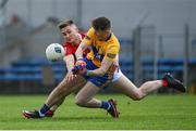 30 May 2021; Gavin Cooney of Clare in action against Kevin Flahive of Cork during the Allianz Football League Division 2 South Round 3 match between Clare and Cork at Cusack Park in Ennis, Clare. Photo by Harry Murphy/Sportsfile