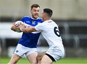 30 May 2021; Eoin Lowry of Laois is tackled by Eoin Doyle of Kildare during the Allianz Football League Division 2 South Round 3 match between Laois and Kildare at MW Hire O'Moore Park in Portlaoise, Laois. Photo by Piaras Ó Mídheach/Sportsfile