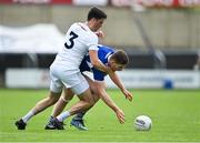 30 May 2021; Evan O'Carroll of Laois is tackled by Mick O'Grady of Kildare during the Allianz Football League Division 2 South Round 3 match between Laois and Kildare at MW Hire O'Moore Park in Portlaoise, Laois. Photo by Piaras Ó Mídheach/Sportsfile