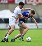 30 May 2021; Evan O'Carroll of Laois is tackled by Mick O'Grady of Kildare during the Allianz Football League Division 2 South Round 3 match between Laois and Kildare at MW Hire O'Moore Park in Portlaoise, Laois. Photo by Piaras Ó Mídheach/Sportsfile