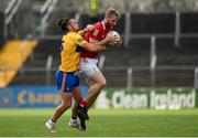 30 May 2021; Ruairi Deane of Cork in action against Cian O'Dea of Clare during the Allianz Football League Division 2 South Round 3 match between Clare and Cork at Cusack Park in Ennis, Clare. Photo by Harry Murphy/Sportsfile