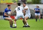 30 May 2021; Evan O'Carroll of Laois in action against Mick O'Grady, 3, and Ryan Houlihan of Kildare during the Allianz Football League Division 2 South Round 3 match between Laois and Kildare at MW Hire O'Moore Park in Portlaoise, Laois. Photo by Piaras Ó Mídheach/Sportsfile