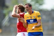 30 May 2021; Cathal O'Connor of Clare celebrates as Ian Maguire of Cork reacts during the Allianz Football League Division 2 South Round 3 match between Clare and Cork at Cusack Park in Ennis, Clare. Photo by Harry Murphy/Sportsfile