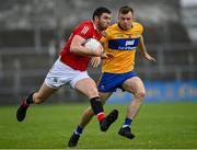 30 May 2021; Luke Connolly of Cork in action against Ciaran Russell of Clare during the Allianz Football League Division 2 South Round 3 match between Clare and Cork at Cusack Park in Ennis, Clare. Photo by Harry Murphy/Sportsfile