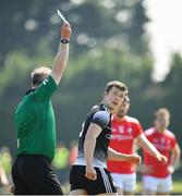 30 May 2021; Dermot Campbell of Louth is shown a black card by referee Sean Laverty during the Allianz Football League Division 4 North Round 3 match between Louth and Sligo at Geraldines Club in Haggardstown, Louth. Photo by Seb Daly/Sportsfile