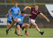 30 May 2021; Colm Basquel of Dublin in action against Peader Ó Cuaig of Galway during the Allianz Football League Division 1 South Round 3 match between Galway and Dublin at St Jarlath's Park in Tuam, Galway. Photo by Ramsey Cardy/Sportsfile