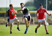 30 May 2021; Cian Lally of Sligo in action against Donal McKenny, left, and Liam Jackson of Louth during the Allianz Football League Division 4 North Round 3 match between Louth and Sligo at Geraldines Club in Haggardstown, Louth. Photo by Seb Daly/Sportsfile