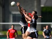 30 May 2021; Sam Mulroy of Louth in action against Darragh Cummins, right, and Paul Kilcoyne of Sligo during the Allianz Football League Division 4 North Round 3 match between Louth and Sligo at Geraldines Club in Haggardstown, Louth. Photo by Seb Daly/Sportsfile