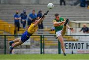 30 May 2021; David Clifford of Kerry kicks a point despite the best efforts of Brian Stack of Roscommon during the Allianz Football League Division 1 South Round 3 match between Roscommon and Kerry at Dr Hyde Park in Roscommon. Photo by Brendan Moran/Sportsfile