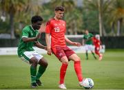 30 May 2021; Darian Males of Switzerland in action against Festy Ebosele of Republic of Ireland during the U21 international friendly match between Switzerland and Republic of Ireland at Dama de Noche Football Centre in Marbella, Spain. Photo by Stephen McCarthy/Sportsfile