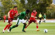 30 May 2021; Festy Ebosele of Republic of Ireland in action against Jan Kronig, left, and Kastriot Imeri of Switzerland during the U21 international friendly match between Switzerland and Republic of Ireland at Dama de Noche Football Centre in Marbella, Spain. Photo by Stephen McCarthy/Sportsfile