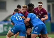 28 May 2021; Ben Murphy of Ireland U20 is tackled by Marcus Kiely, left, and Vakh Abdaladze of Leinster A during the match between Ireland U20 and Leinster A at Energia Park in Dublin. Photo by Ramsey Cardy/Sportsfile
