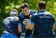 31 May 2021; James Ryan is tackled by Scott Penny, left, and Vakh Abdaladze during Leinster Rugby squad training at UCD in Dublin. Photo by Ramsey Cardy/Sportsfile