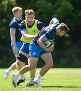 31 May 2021; Jordan Larmour is tackled by Martin Moloney during Leinster Rugby squad training at UCD in Dublin. Photo by Ramsey Cardy/Sportsfile
