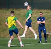 31 May 2021; Daryl Horgan heads the ball as coach Anthony Barry watches on during a Republic of Ireland training session at PGA Catalunya Resort in Girona, Spain. Photo by Stephen McCarthy/Sportsfile