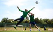 1 June 2021; Goalkeeper Gavin Bazunu punches the ball clear ahead of Troy Parrott during a Republic of Ireland training session at PGA Catalunya Resort in Girona, Spain. Photo by Stephen McCarthy/Sportsfile