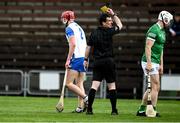 23 May 2021; Referee Paud O'Dwyer shows a yellow card to Calum Lyons of Waterford during the Allianz Hurling League Division 1 Group A Round 3 match between Waterford and Limerick at Walsh Park in Waterford. Photo by Sam Barnes/Sportsfile