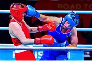 4 June 2021; Aoife O'Rourke of Ireland, right, and Viktoryia Kebikava of Belarus in their middleweight 75kg round of 16 bout on day one of the Road to Tokyo European Boxing Olympic qualifying event at Le Grand Dome in Paris, France. Photo by Baptiste Fernandez/Sportsfile