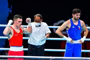 4 June 2021; Emmet Brennan of Ireland, left, is declared the winner over Uke Smajli of Switzerland after their light heavyweight 81kg round of 16 bout on day one of the Road to Tokyo European Boxing Olympic qualifying event at Le Grand Dome in Paris, France. Photo by Baptiste Fernandez/Sportsfile