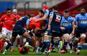 28 May 2021; CJ Stander of Munster is tackled by Cardiff Blues players, from left, Ben Thomas, Tomos Williams, and James Botham during the Guinness PRO14 Rainbow Cup match between Munster and Cardiff Blues at Thomond Park in Limerick. Photo by Piaras Ó Mídheach/Sportsfile