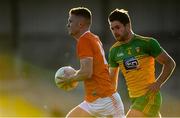 29 May 2021; Ross McQuillan of Armagh in action against Brendan McCole of Donegal during the Allianz Football League Division 1 North Round 3 match between Armagh and Donegal at the Athletic Grounds in Armagh. Photo by Piaras Ó Mídheach/Sportsfile