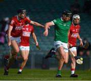 5 June 2021; Conor Boylan of Limerick is tackled by Sean O'Leary Hayes, 2, Robert Downey, 7, and Mark Coleman of Cork during the Allianz Hurling League Division 1 Group A Round 4 match between Limerick and Cork at LIT Gaelic Grounds in Limerick. Photo by Ray McManus/Sportsfile