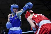 5 June 2021; Kellie Harrington of Ireland, left, and Maïva Hamadouche of France during their lightweight 60kg quarter-final bout on day two of the Road to Tokyo European Boxing Olympic qualifying event at Le Grand Dome in Paris, France. Photo by Sportsfile