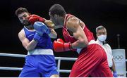 5 June 2021; Kirill Afanasev of Ireland, left, and Emmanuel Reyes of Spain in their heavyweight 91kg round of 16 bout on day two of the Road to Tokyo European Boxing Olympic qualifying event at Le Grand Dome in Paris, France. Photo by Sportsfile