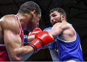 5 June 2021; Kirill Afanasev of Ireland, right, and Emmanuel Reyes of Spain in their heavyweight 91kg round of 16 bout on day two of the Road to Tokyo European Boxing Olympic qualifying event at Le Grand Dome in Paris, France. Photo by Sportsfile