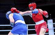 5 June 2021; Aoife O'Rourke of Ireland, right, and Elzbieta Wójcik of Poland during their middleweight 75kg quarter-final bout day two of the Road to Tokyo European Boxing Olympic qualifying event at Le Grand Dome in Paris, France. Photo by Sportsfile