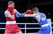 5 June 2021; Brendan Irvine of Ireland, left, and Gabriel Escobar of Spain during their flyweight 52kg quarter-final bout on day two of the Road to Tokyo European Boxing Olympic qualifying event at Le Grand Dome in Paris, France. Photo by Sportsfile