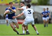 30 May 2021; Evan O'Carroll of Laois in action against Mick O'Grady ,right, and Ryan Houlihan of Kildare during the Allianz Football League Division 2 South Round 3 match between Laois and Kildare at MW Hire O'Moore Park in Portlaoise, Laois. Photo by Piaras Ó Mídheach/Sportsfile