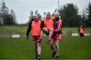 10 June 2021; Paulinus Curran is carried off the field after sustaining an injury by Seamus McMahon, left, and Ciaran McMahon at the GAA for Dads & Lads Launch at St. Patricks GFC in Donagh, Fermanagh. Photo by David Fitzgerald/Sportsfile