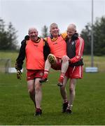 10 June 2021; Paulinus Curran is carried off the field after sustaining an injury by Seamus McMahon, left, and Ciaran McMahon at the GAA for Dads & Lads Launch at St. Patricks GFC in Donagh, Fermanagh. Photo by David Fitzgerald/Sportsfile