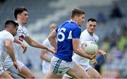 30 May 2021; Evan O'Carroll of Laois in action against Kildare players Ryan Houlihan, Mick O'Grady and Eoin Doyle during the Allianz Football League Division 2 South Round 3 match between Laois and Kildare at MW Hire O'Moore Park in Portlaoise, Laois. Photo by Piaras Ó Mídheach/Sportsfile