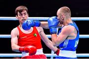 6 June 2021; Aidan Walsh of Ireland, left, and Yevhenii Barabanov of Ukraine in their welterweight 69kg quarter-final bout on day three of the Road to Tokyo European Boxing Olympic qualifying event at Le Grand Dome in Paris, France. Photo by Baptiste Fernandez/Sportsfile