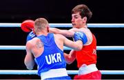 6 June 2021; Aidan Walsh of Ireland, right, and Yevhenii Barabanov of Ukraine in their welterweight 69kg quarter-final bout on day three of the Road to Tokyo European Boxing Olympic qualifying event at Le Grand Dome in Paris, France. Photo by Baptiste Fernandez/Sportsfile