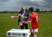 6 June 2021; Uachtarán Chumann Lúthchleas Gael Larry McCarthy presents the Louth captain Feidhleim Joyce after the Allianz Hurling League Roinn 3B match between Louth and Fermanagh at Louth Centre of Excellence in Darver, Louth. This was the President’s first trophy presentation since he too up office. Photo by David Fitzgerald/Sportsfile