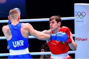 6 June 2021; Aidan Walsh of Ireland, right, and Yevhenii Barabanov of Ukraine in their welterweight 69kg quarter-final bout on day three of the Road to Tokyo European Boxing Olympic qualifying event at Le Grand Dome in Paris, France. Photo by Baptiste Fernandez/Sportsfile