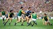9 June 1991; Vinny Murphy of Dublin in action against Meath players, from left, Kevin Foley, Liam Harnan, Robbie O'Malley and John McDermott during the Leinster GAA Football Senior Championship Preliminary Round replay match between Dublin and Meath at Croke Park in Dublin. Photo by David Maher/Sportsfile
